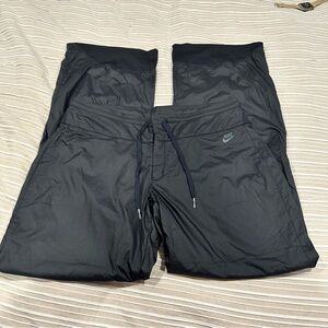 Nike Sportswear Women’s Black pants size medium wide leg lined swoosh basketball